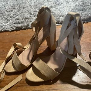 Size 71/2 nude strap up heels by Huiyuzhi